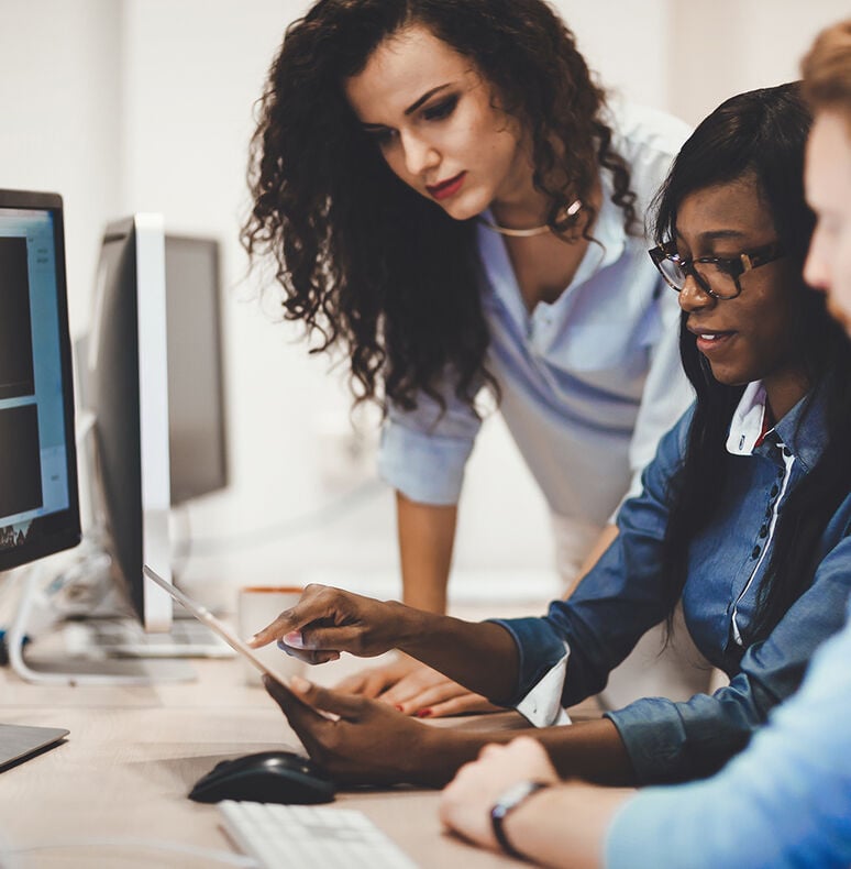 Diverse group of business executives analyzing a ticketing report